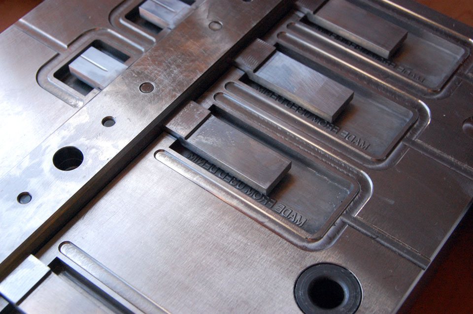 Machined mold with text cut into the cavities